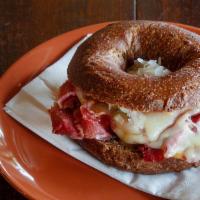 Reuben · You choice of bagel topped with our house corned beef, eastern european sour kraut (olykraut...