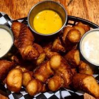 *PRETZEL BITES & BEER CHEESE · (2) Jumbo soft Pretzels, chopped & deep fried, served w/ 5oz of Guinness beer cheese & musta...