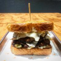 *TEXAS PATTY MELT · Texas toast, (2) 3.5oz smash patties, topped with sauteed onions, (2) swiss cheese slices, d...