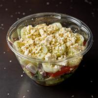 Greek Salad · Tomatoes, mix greens, onions, cucumber, olives, feta cheese, olive oil and oregano.