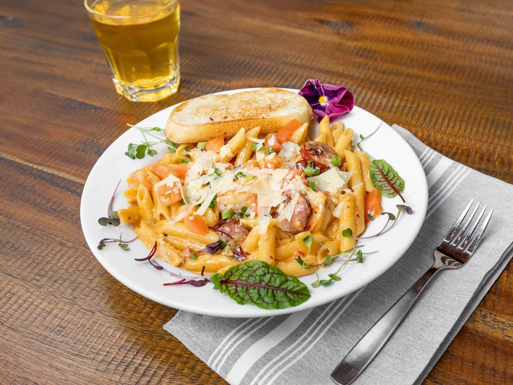 Cajun Pasta · Penne pasta, garlic, tomato, red and green peppers, Cajun Alfredo sauce, smoked sausage served with garlic bread. Add chicken, shrimp or salmon for an additional charge.