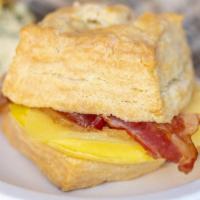 Bacon, Egg, Cheddar Biscuit · Thick-cut bacon, a hearth-baked egg, and white cheddar on a sea salt buttermilk biscuit.
