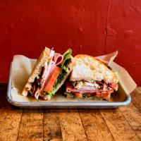 Club · Grobbels turkey, dearborn ham, thick-cut bacon, herb mayo, lettuce mix, and tomato on farnsw...