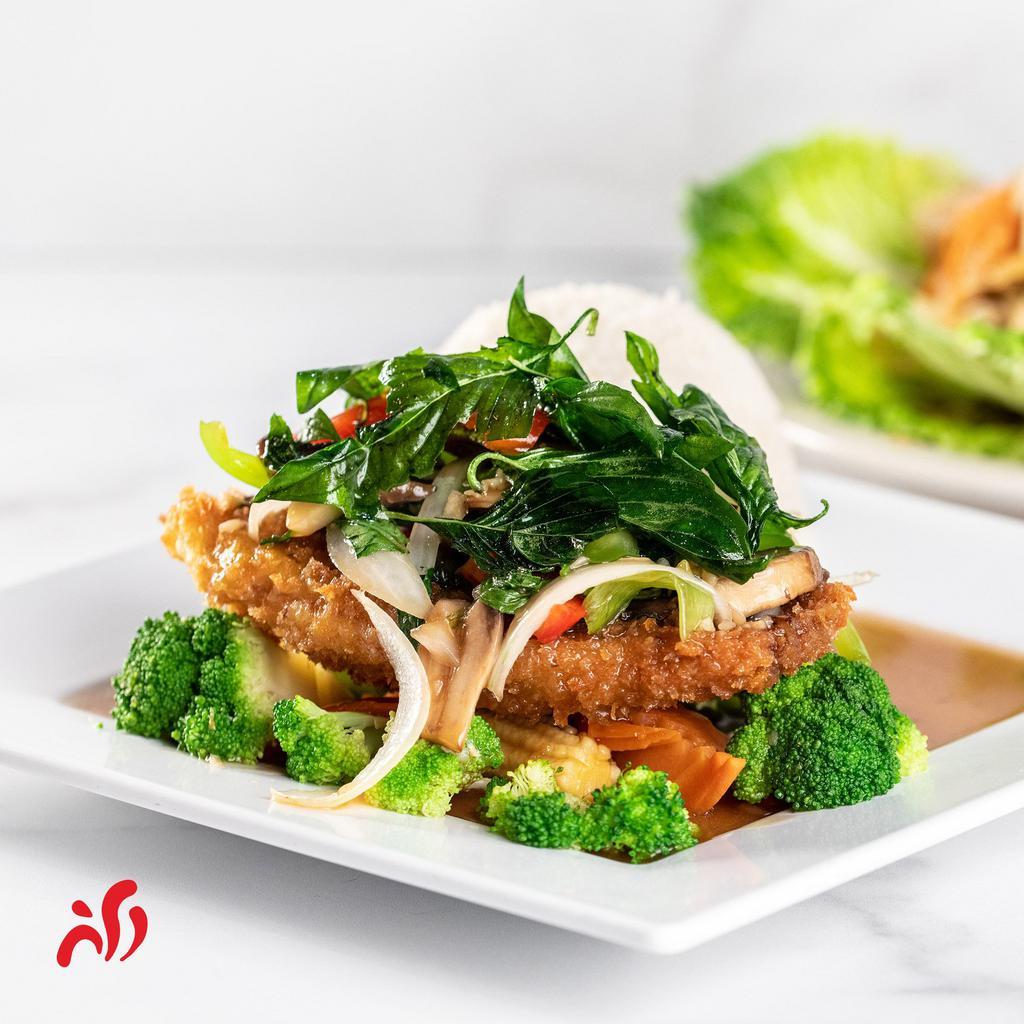 Crispy Red Snapper · Deep fried red snapper sushi grade served with steamed vegetables, basil sauce and steamed rice.