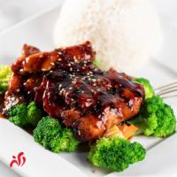Chicken Teriyaki · Grilled chicken served with steamed vegetables, rice and teriyaki sauce.