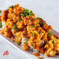 New Orleans Roll · Crabmeat, cucumber and avocado topped with spicy crawfish, spicy mayo and scallion.