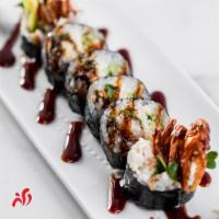 Spider Roll · Soft shell crab, crabmeat, masago, cucumber, sprout, avocado topped with eel sauce. Cooked.