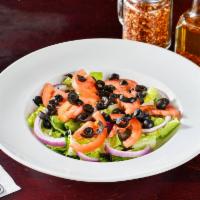 House Salad · Salad served with romaine lettuce, tomatoes onions and olives with your choice of dressing.