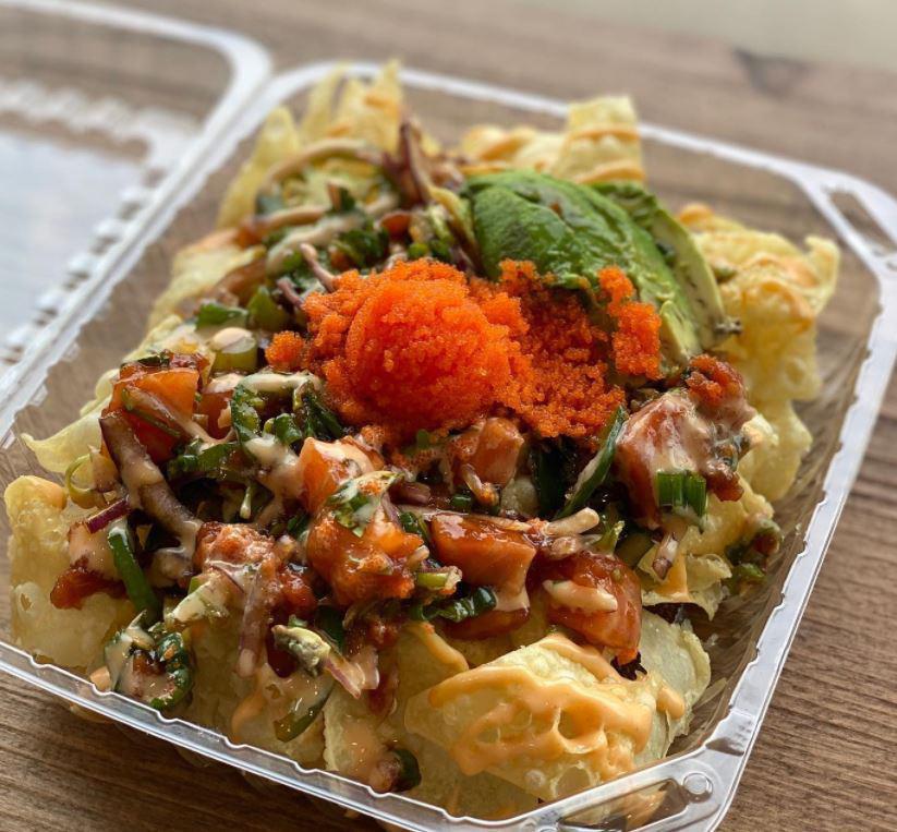 Poke Nachos · Served on top of our crispy wonton chips Your Choice of 2 Proteins mix with Jalapeños, cilantro, red onion, green onions & our special Poke Nacho sauce. Topped off with massage, avocado, and drizzle of spicy mayo. Extra protein for an additional charge.