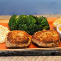 Crab Cakes · Pan-seared lump crab cakes served with house cut fries, chef's choice of vegetable and Cajun...