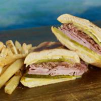 Island Cuban Sandwich · Pulled pork, sliced ham, Swiss cheese, sliced pickles and mustard, pressed in a crusty Cuban...