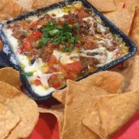 Queso Fundido · Mix of cheeses, with chorizo. Served with chips. Gluten-free preparation is available upon r...