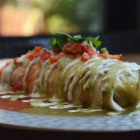 El Burrito · Large flour tortilla filled with rice, beans, and your choice of meat. Topped with tomatillo...