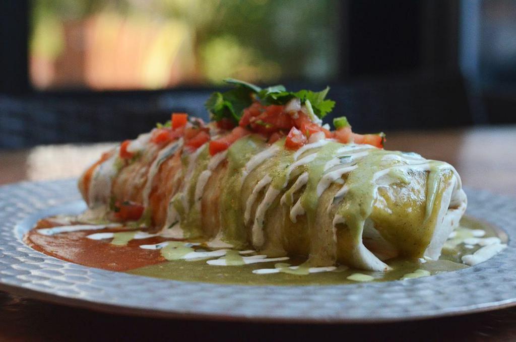 El Burrito · Large flour tortilla filled with rice, beans, and your choice of meat. Topped with tomatillo sauce, ranchera sauce, melted cheese, pico de gallo, avocado crema, and crema mexicana.