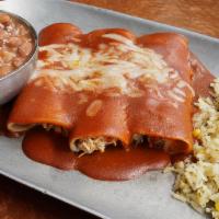 Enchiladas Clasica · Three corn tortillas rolled in sauce, melted cheese, your choice of meat, served with rice a...