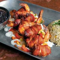 Camarones Cancun · Cheese stuffed prawns and wrapped in bacon. Served with veggies, rice, beans and tortillas.