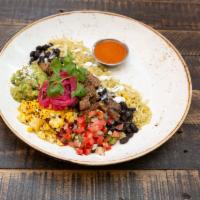 Gourmet Parrilla Bowl · Mexican rice bowl with cilantro lime rice, black beans, cheese, pico de gallo, crema, red on...