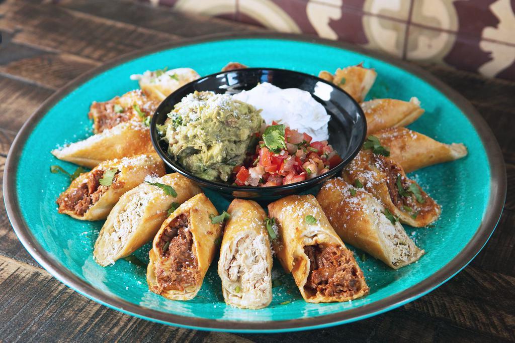 Crispy Flautas Platter · Rolled crispy flour tortillas filled with jack cheese and seasoned chicken or barbacoa shredded beef. Includes guacamole and sour cream. 15 Flautas (30 Halves)
