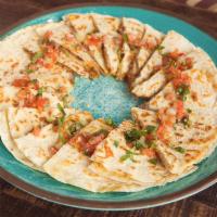 Quesadilla Platter · Any combination of barbacoa shredded beef or shredded chicken. A platter of 24 slices.