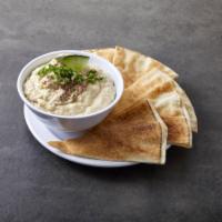 Baba Ghanouj · Baked eggplant diced with garlic, lemon and tahina. Served with pita bread. 