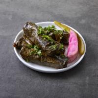 Grape Leaves · Grape leaves stuffed with rice, tomatoes and parsley. Served with pita bread. 