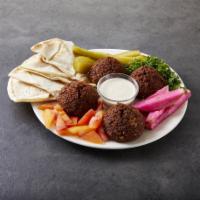 Falafel · Chickpeas and fava beans mixed with vegetables. Served with pita bread. 