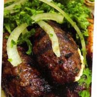 Kafta Kabob  · Ground beef with onions and parsley. Includes rice and one side. 