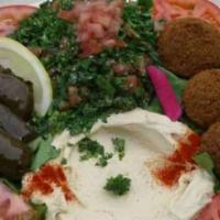 Vegetarian Combo · Falafel, hummus, tabbouli and grape leaves. Includes rice and one side. 