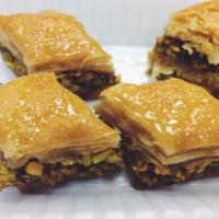 Baklava · Crispy, sweet, baked dough with nuts stuffing 