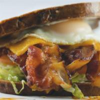 The Ultimate BLT · Toasted marble rye bread loaded with bacon, lettuce, tomato, melted cheddar cheese, mayo and...