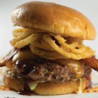 Smokehouse Burger · Hand-patty topped with bacon and covered with sweet BBQ sauce, cheddar cheese, and tumblewee...
