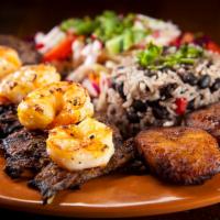 Surf and Turf Dinner  · Succulent garlic shrimp (or salmon) and your choice of sizzling skirt steak or chicken. Serv...