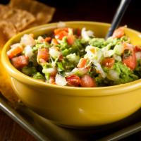 Guacamole and Chips · Freshest avocados mashed and topped with pico de gallo.
