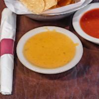 Chile con Queso · Melted cheese dip. 