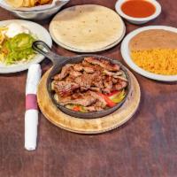 Sizzling Fajitas Combo Beef and Chicken · Combination of chicken and beef.