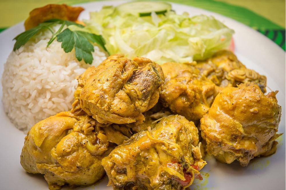 Curried Chicken Dish · Small. Served with white rice, rice, peas, steamed vegetables, and sweet plantain.