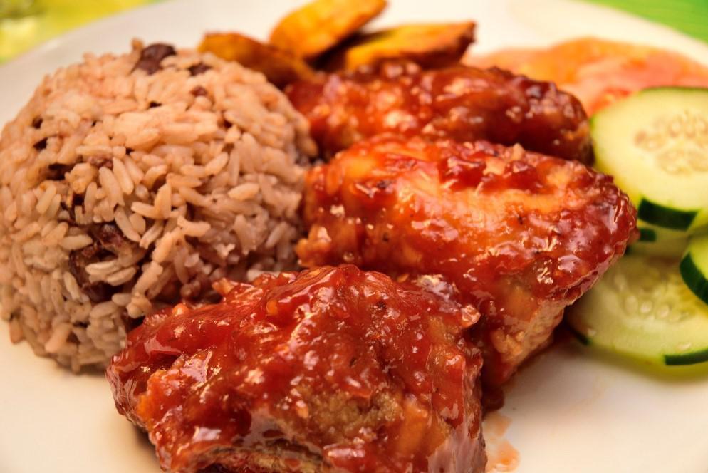 Sweet and Spicy Chicken Dish · Spicy. Served with white rice, rice and peas, steamed vegetables, and sweet plantain.