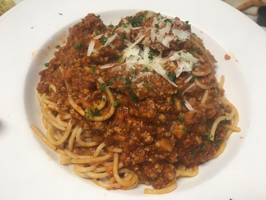 Pasta Bolognese · Served over spaghetti 