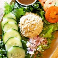 Tuna Salad · In a bed of green leaf lettuce; homemade specialty tuna, sliced tomato, cucumber and onion w...