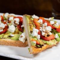 Avocado Toast · Fresh avocado, bell pepper, goat cheese, and a balsamic reduction on toasted artisan sourdou...