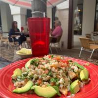 Shrimp Ceviche · Steamed shrimp marinated in lime juice with fresh jalapenos, onion, avocado and cilantro.