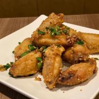 Salt and Pepper Chichen Wings · Cooked wing of a chicken coated in sauce or seasoning.