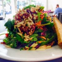 Baby Kale Salad · Quinoa, barley, toasted almonds, carrots, purple cabbage, dried cranberries and lemon vinaig...