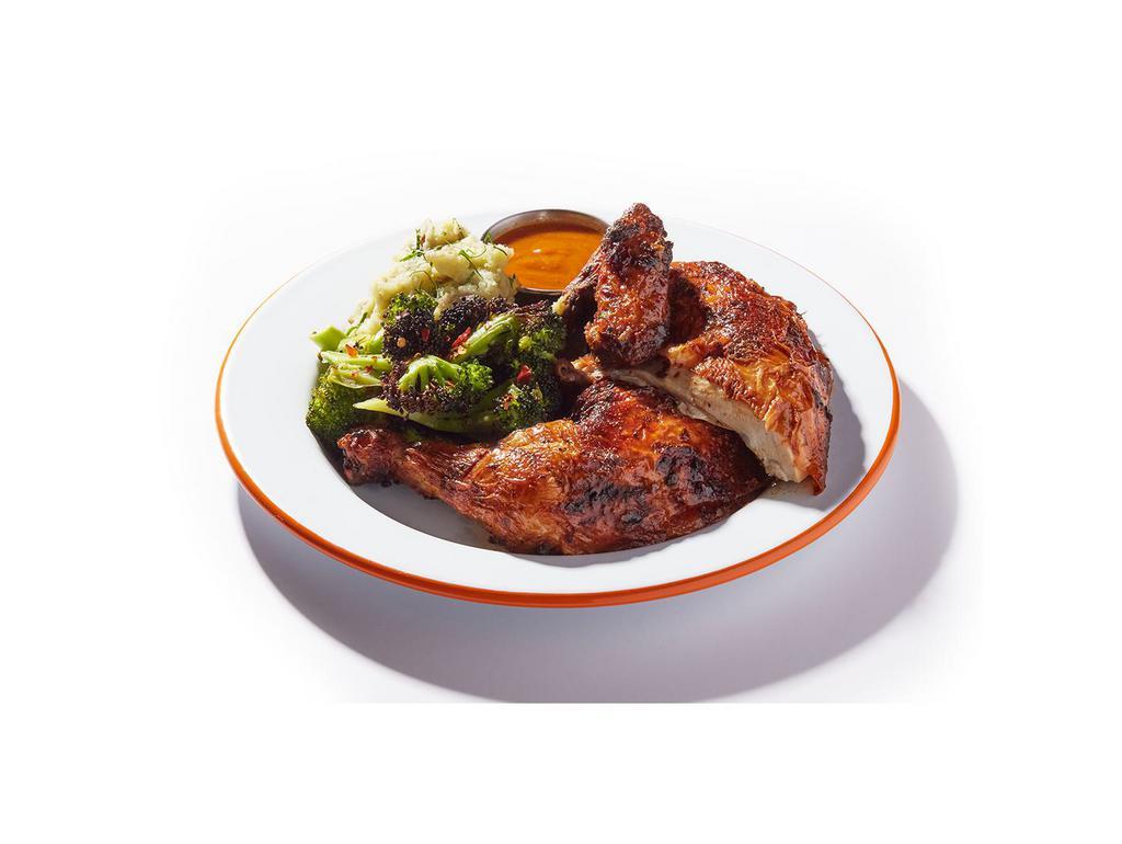 Half Rotisserie Chicken With Sides · Our og rotisserie chicken marinated with thyme, rosemary and garlic.