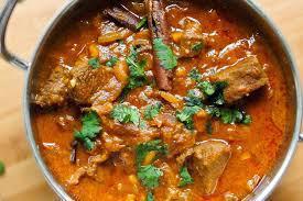 Goat Curry · Bone in goat meat cooked with fresh ground spices.
