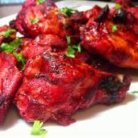 Tandoori Chicken · Tandoori chicken is the best known Indian delicacy, bone in chicken marinated with special s...