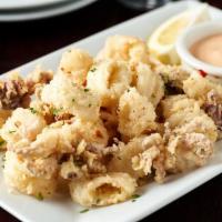 Calamari Fritti · dusted with seasoned flour, served with roasted bell pepper aioli.