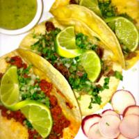 tacos · 4 corn tortilla filled with your choice of meat, topped with onions & cilantro. limes, radis...