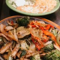 Vegetarian Fajita · Mix of sauteed mushrooms, spinach, broccoli, onions, tomatoes, and bell peppers. Served with...