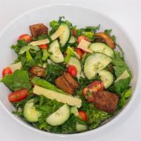 Kale Caesar Salad · Kale, romaine, tomato, cucumbers, Parmesan cheese, croutons, Caesar dressing.